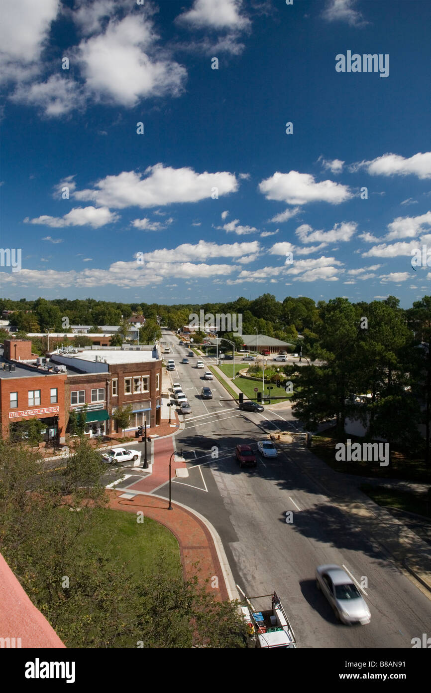 Photo of a city scene from a height.  Features blue sky and big clouds. Stock Photo