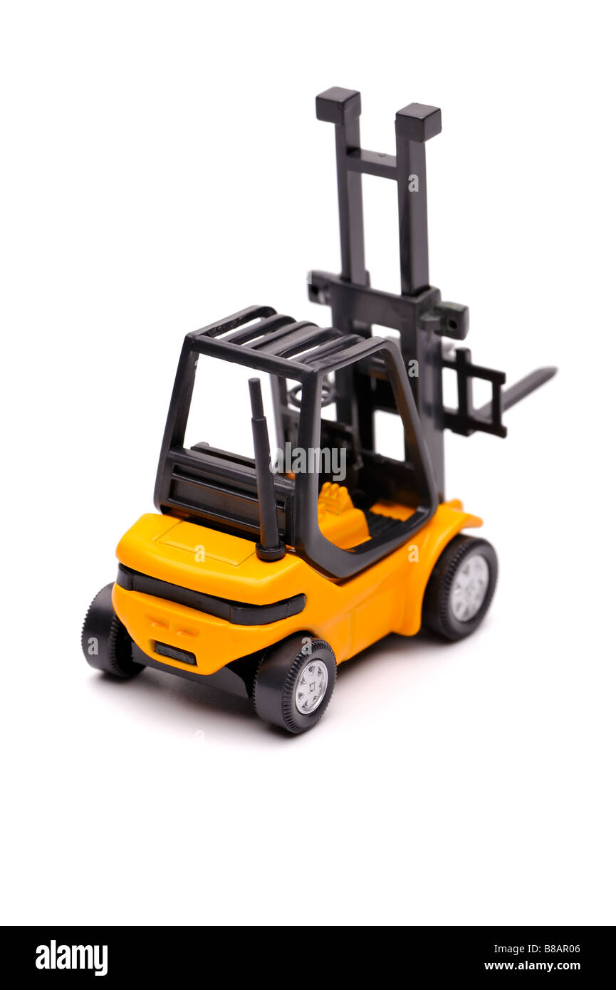 Yellow toy forklift on a white background Stock Photo
