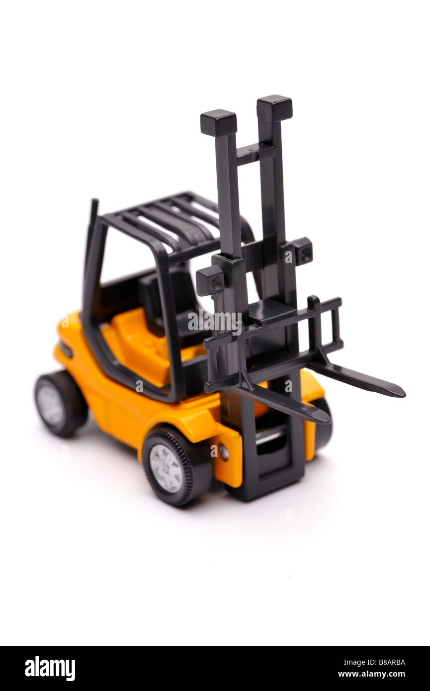 Yellow toy forklift on a white background Stock Photo