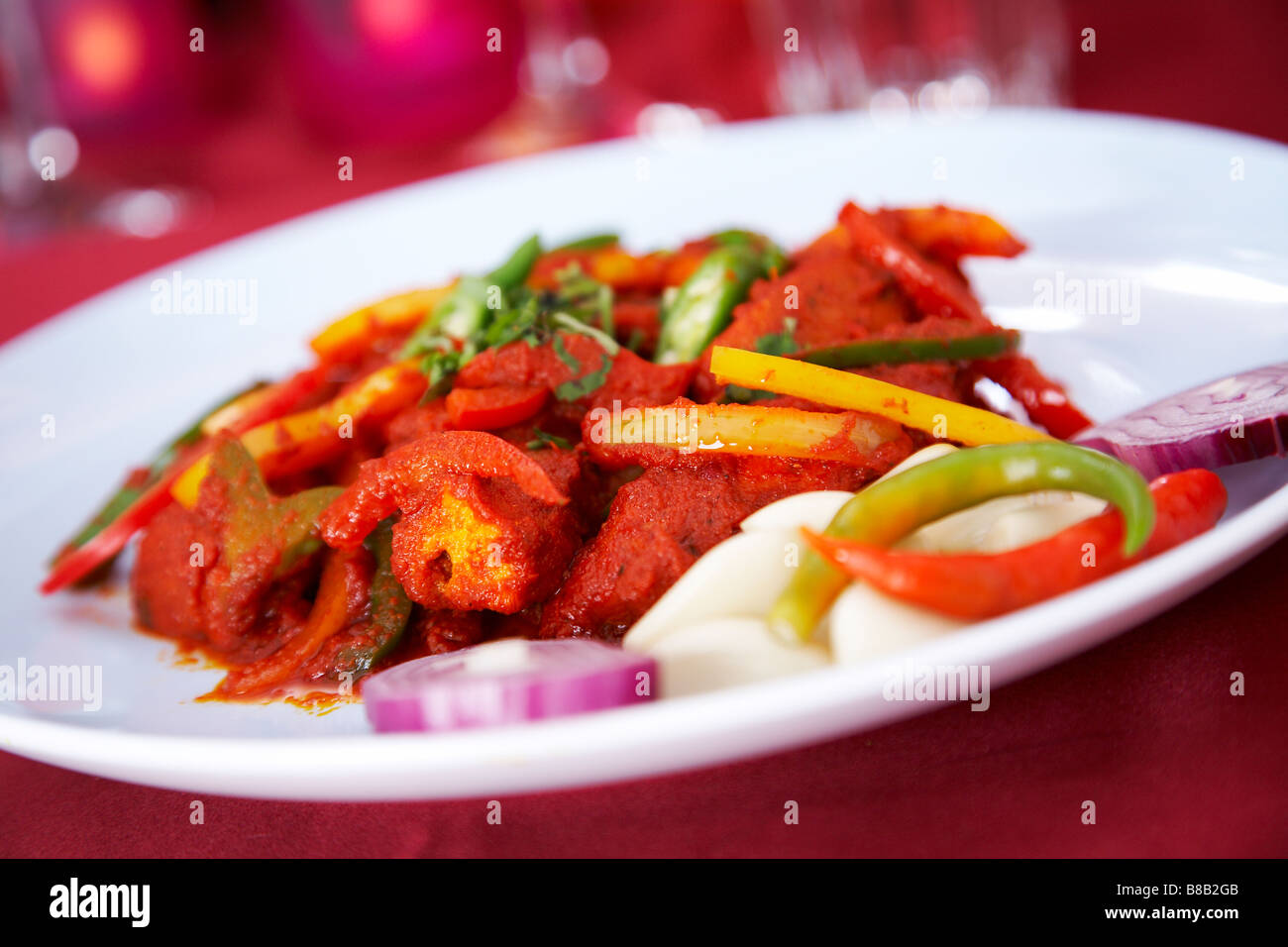 Chicken jalfrezi  on a plate in a restaurant. Stock Photo