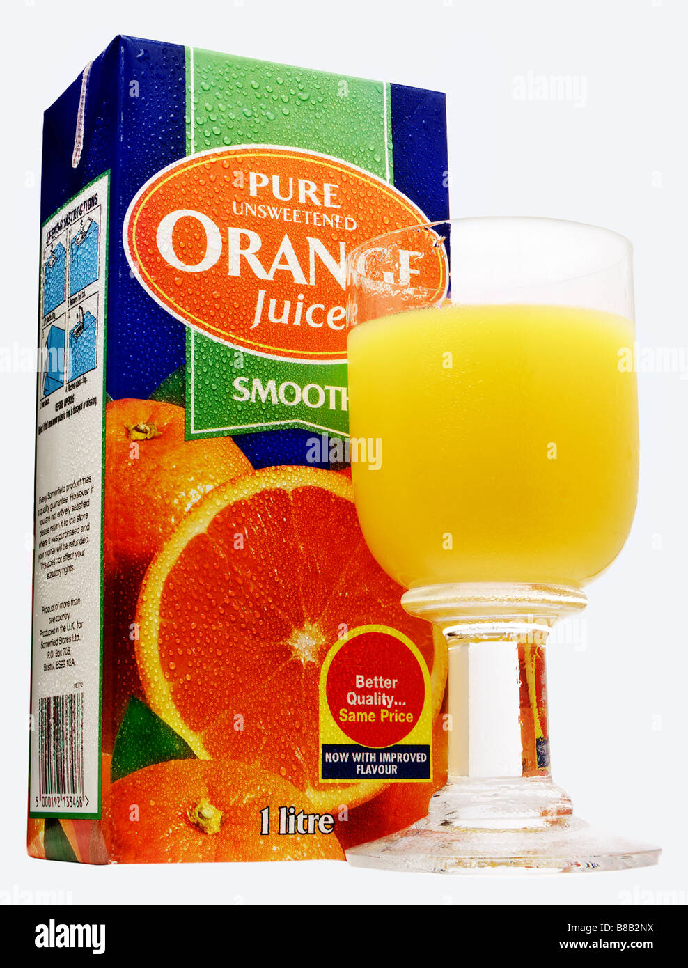 Carton of orange juice and glass Stock Photo