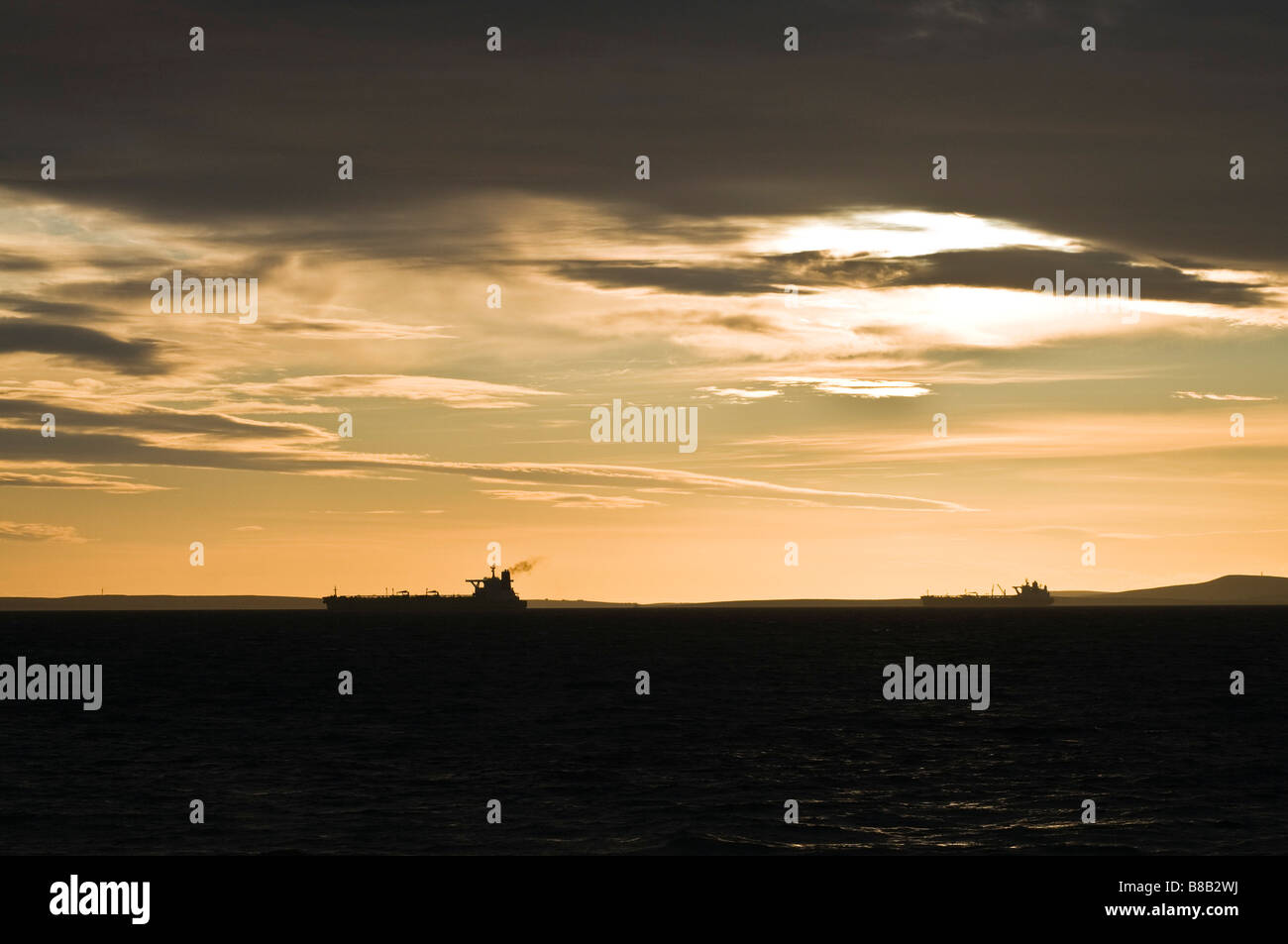 dh  SCAPA FLOW ORKNEY Oil tankers supertankers anchored sunset scotland oiltankers ships tanker Stock Photo