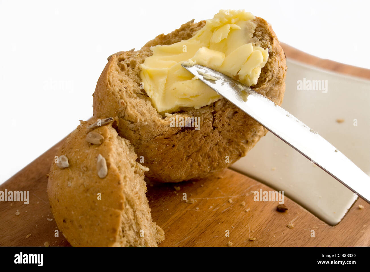 Bread, knife, butter Stock Photo