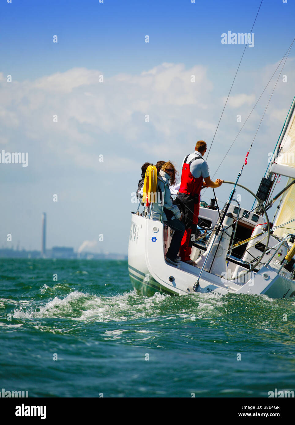 Image of a yacht sailing on the Solent,England. It features the crew
