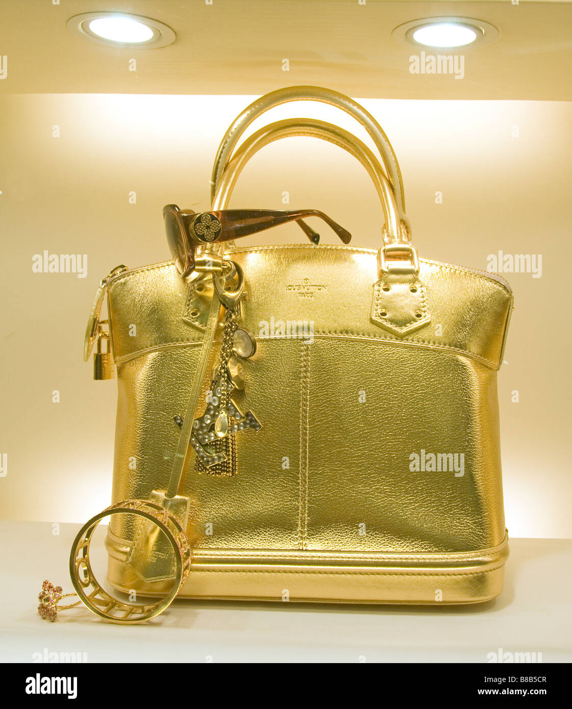 Louis Vuitton golden handbag bag shopping mall Petronas Twin Towers shop show window Kuala Lumpur Malaysia Stock Photo