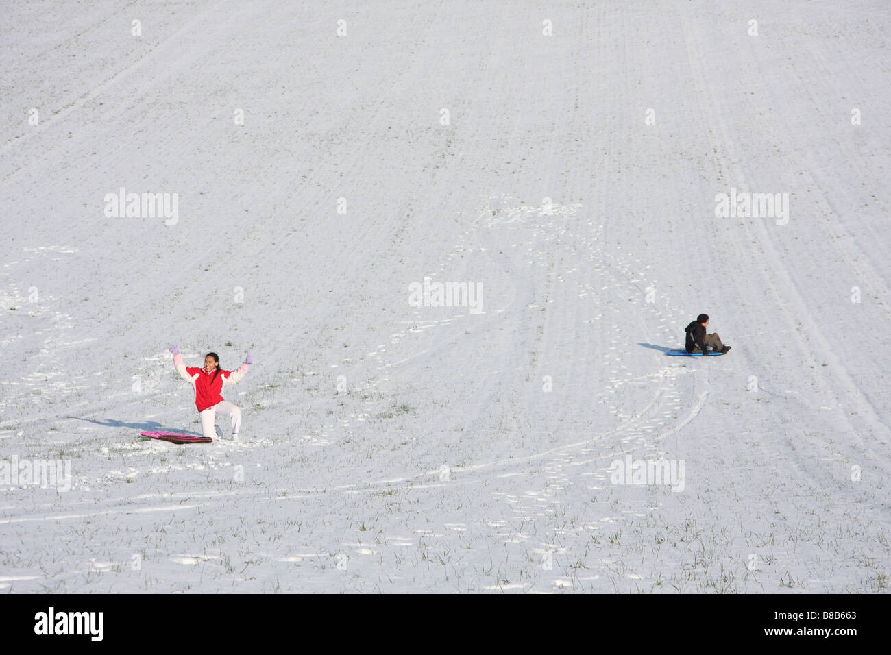 snowscape snow brother sister playing play fun Stock Photo - Alamy