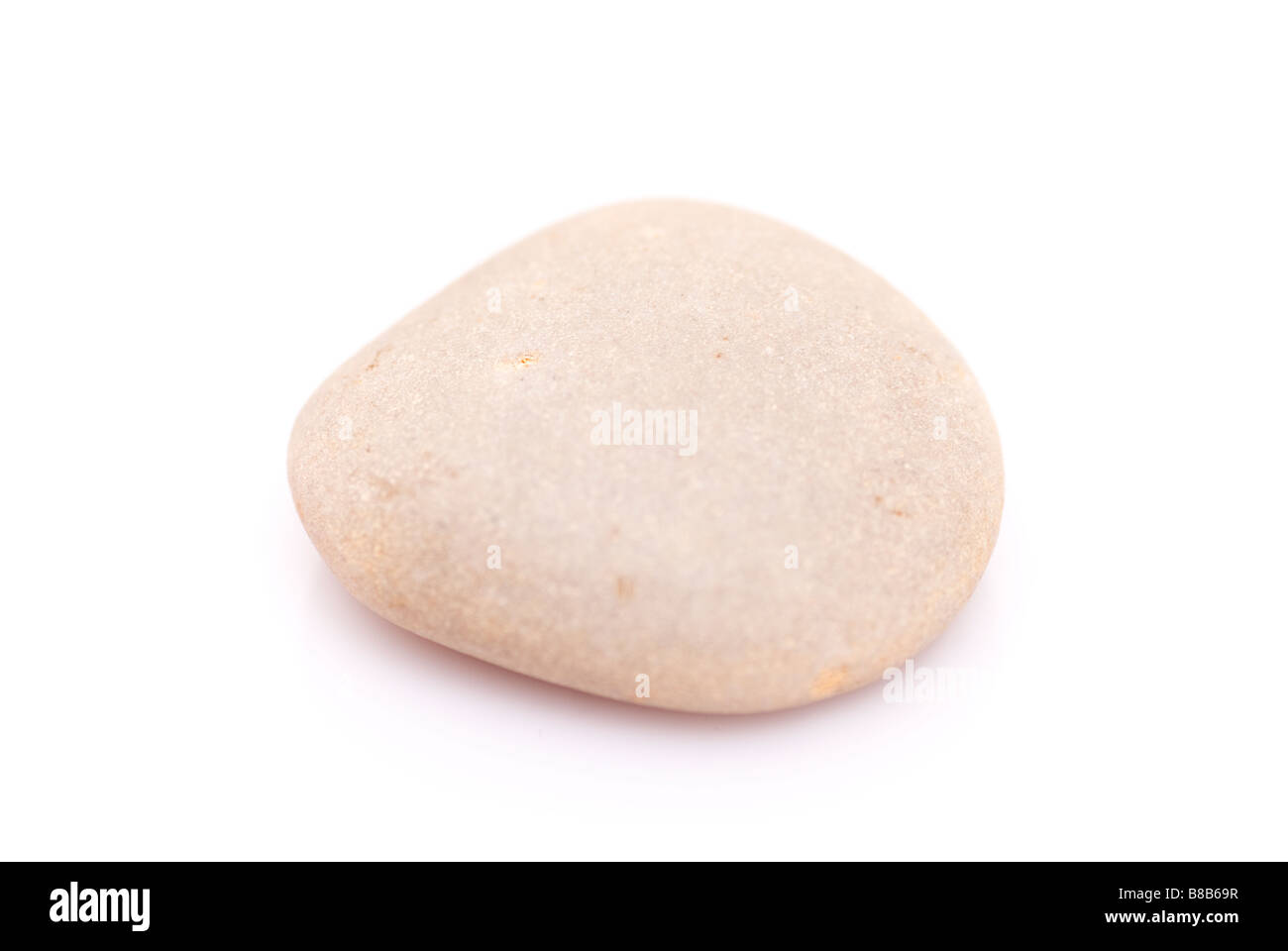Single pebble stone cutout on a white background Stock Photo