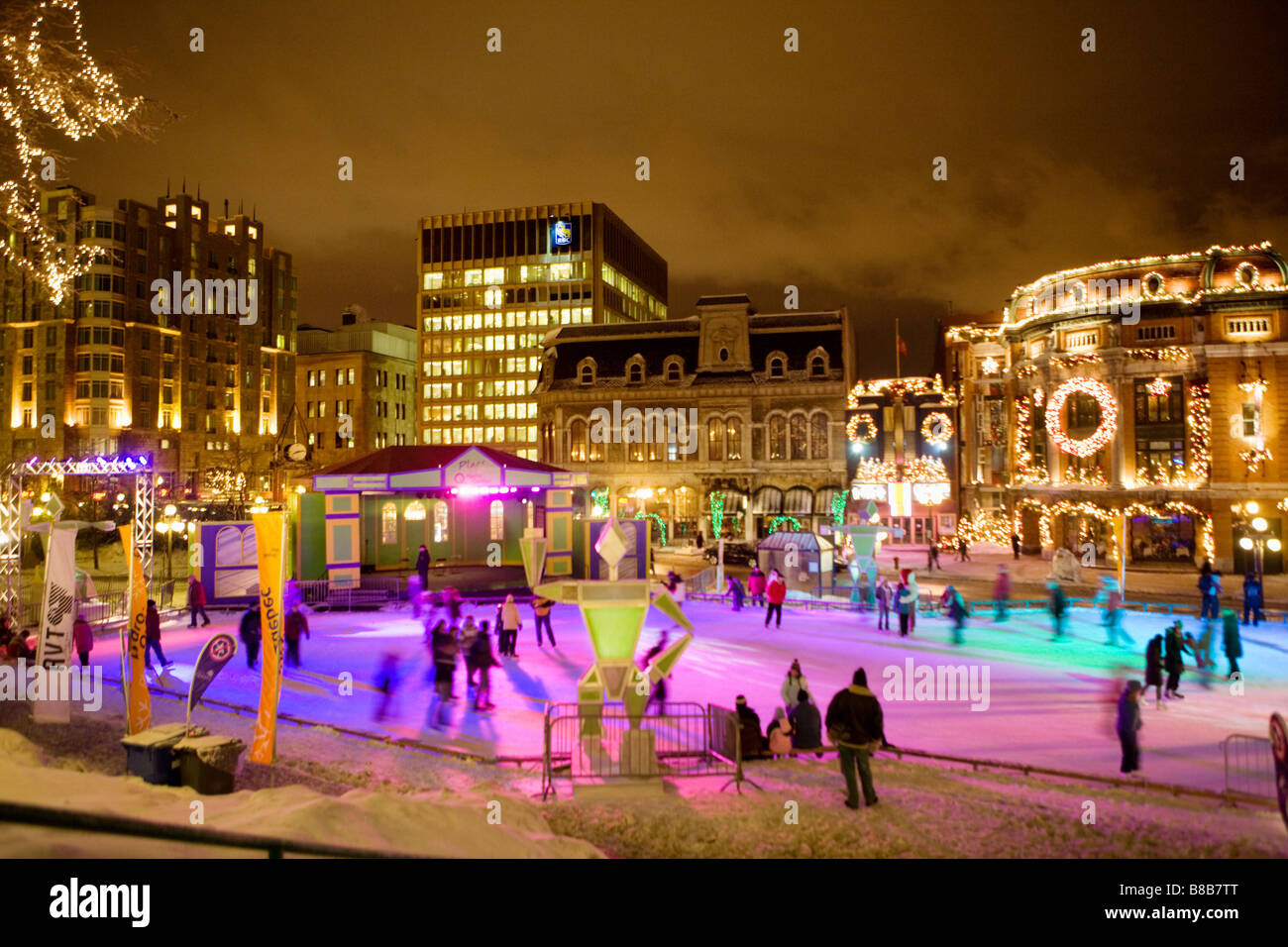 People ice skating at Place Hydro Quebec fronting Capitole Theater Winter Carnival Quebec City canada Stock Photo