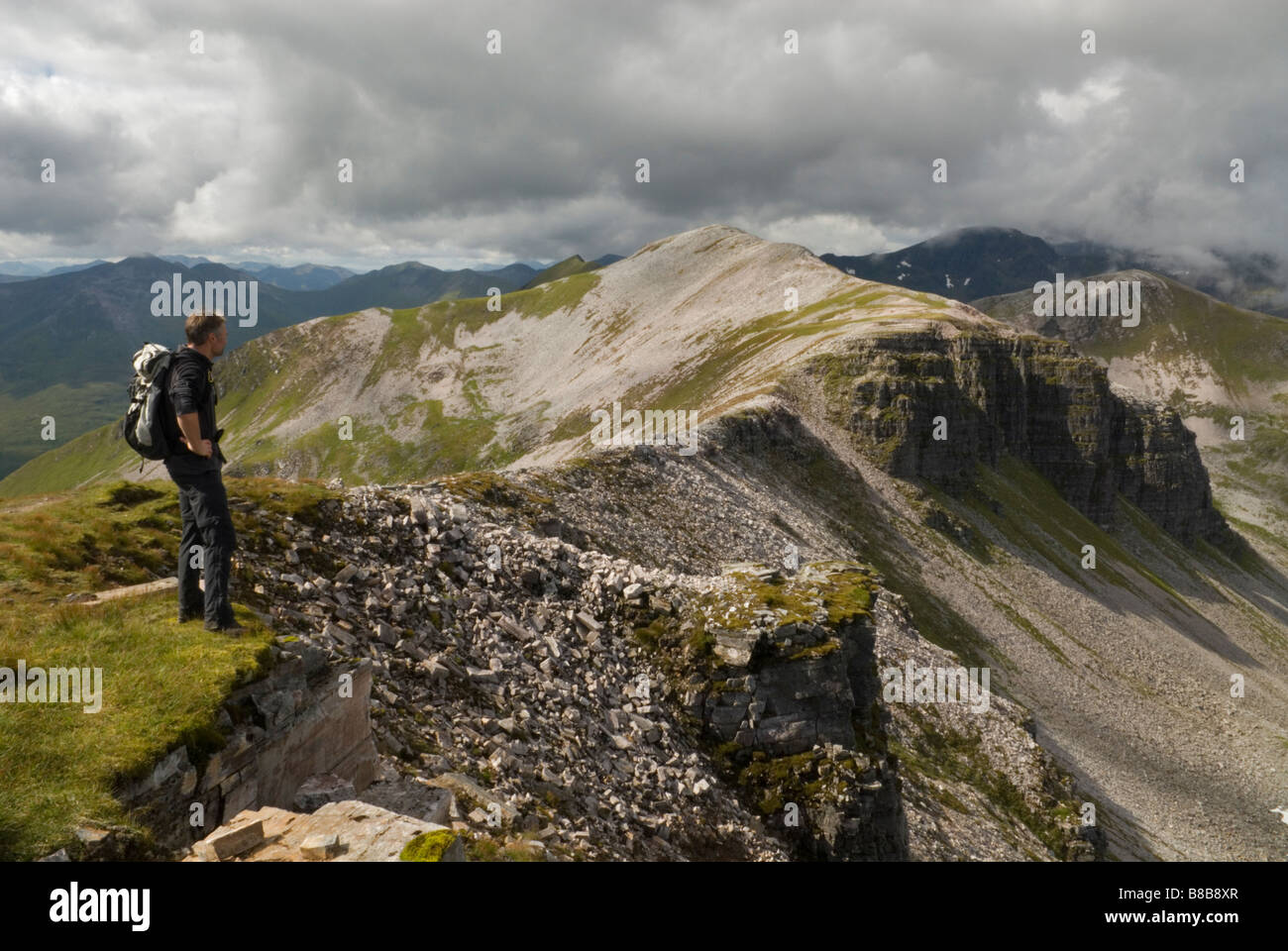 HILL WALKER LOOKING TOWARDS STOB COIRE AN LAOIGH MUNRO THE GREY CORRIES LOCHABER SCOTLAND AUGUST