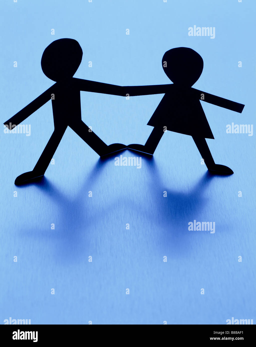 Paper dolls holding hands hires stock photography and images Alamy