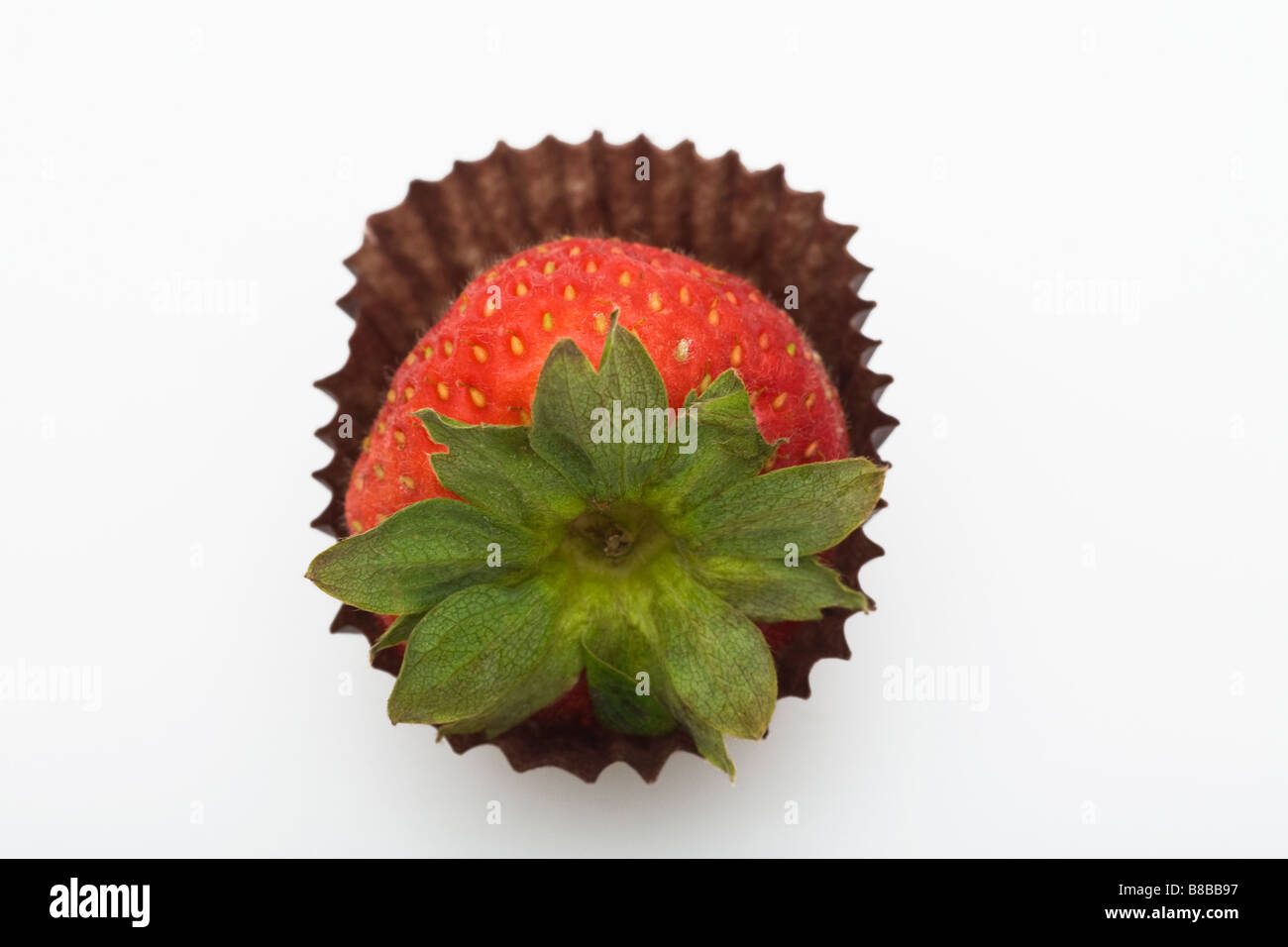 A strawberry in a paper cup Stock Photo - Alamy