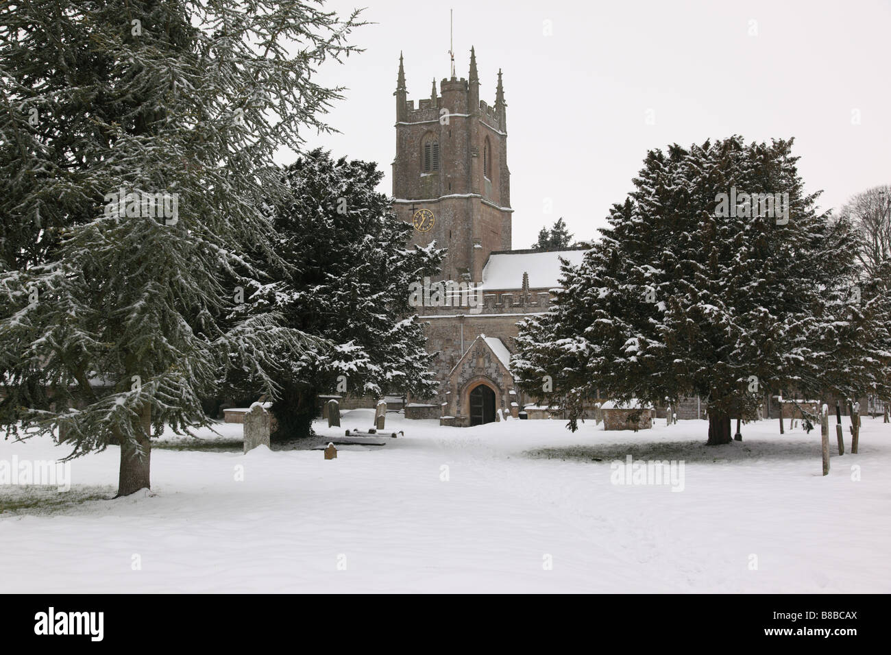 Saint James Church Avebury in the snow, Wiltshire, England, UK Stock Photo