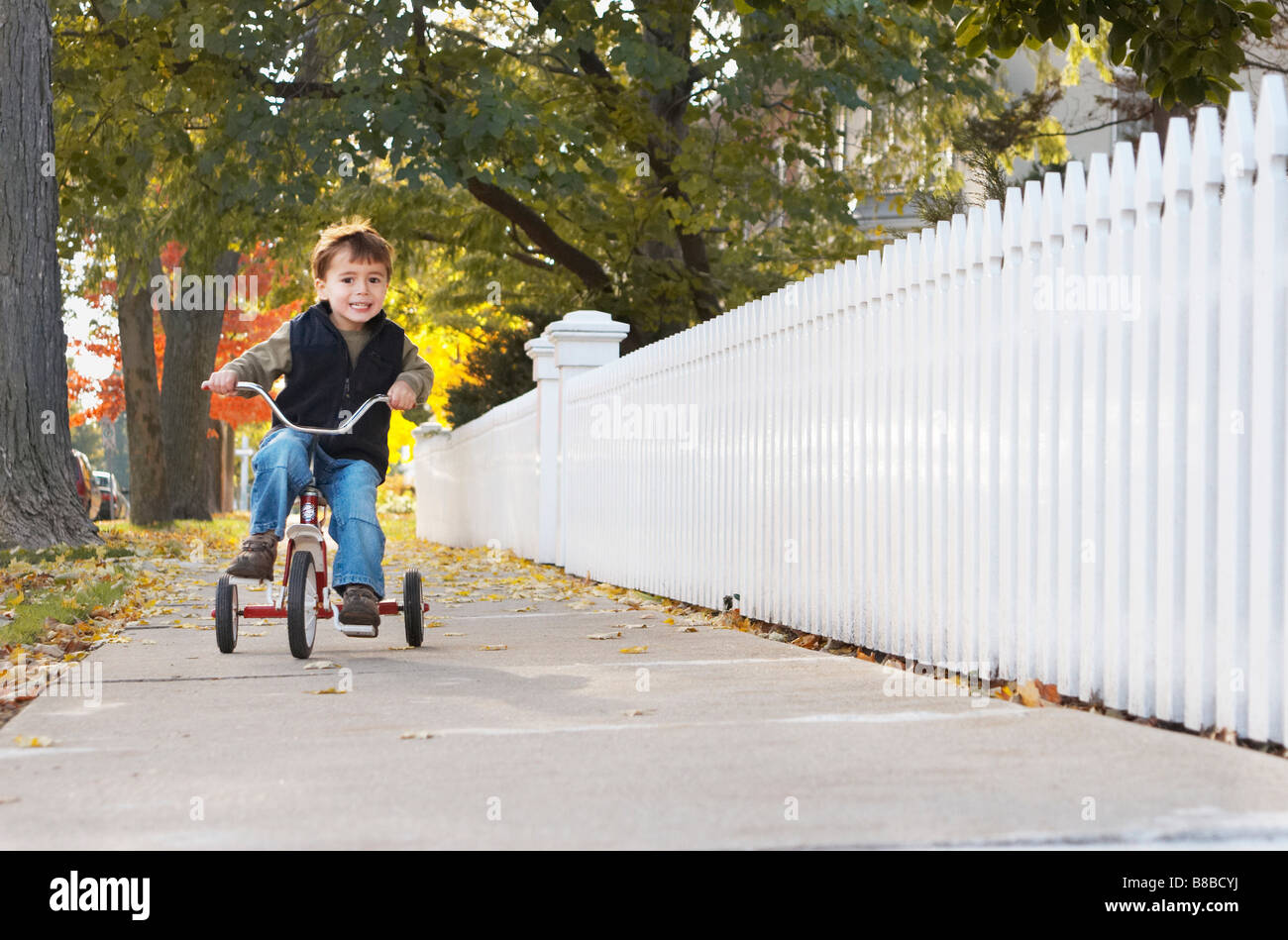Little Boy Riding Tricycle Autumn, Brampton,Ontario Stock Photo