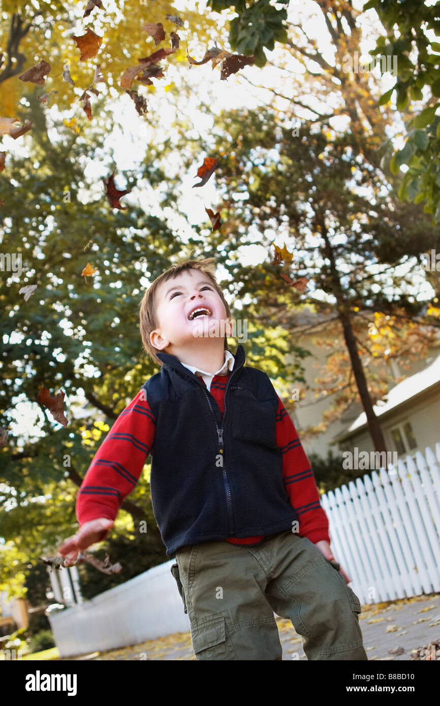 Little Boy Throwing Leaves  Air, Brampton,Ontario Stock Photo