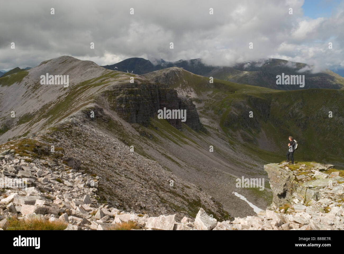 HILL WALKER LOOKING TOWARDS STOB COIRE AN LAOIGH MUNRO THE GREY CORRIES LOCHABER SCOTLAND AUGUST