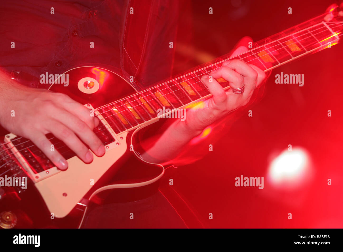 a guitar player at a live concert Stock Photo