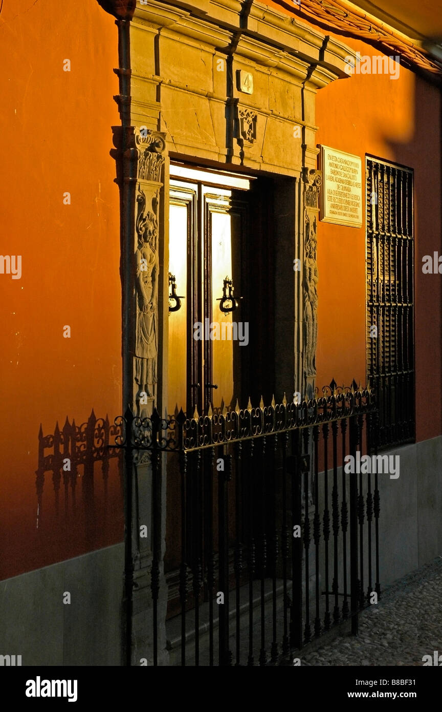 The setting sun illuminates an old doorway to one of Granada's grand old houses, Granada, Andalucia, Spain. Stock Photo