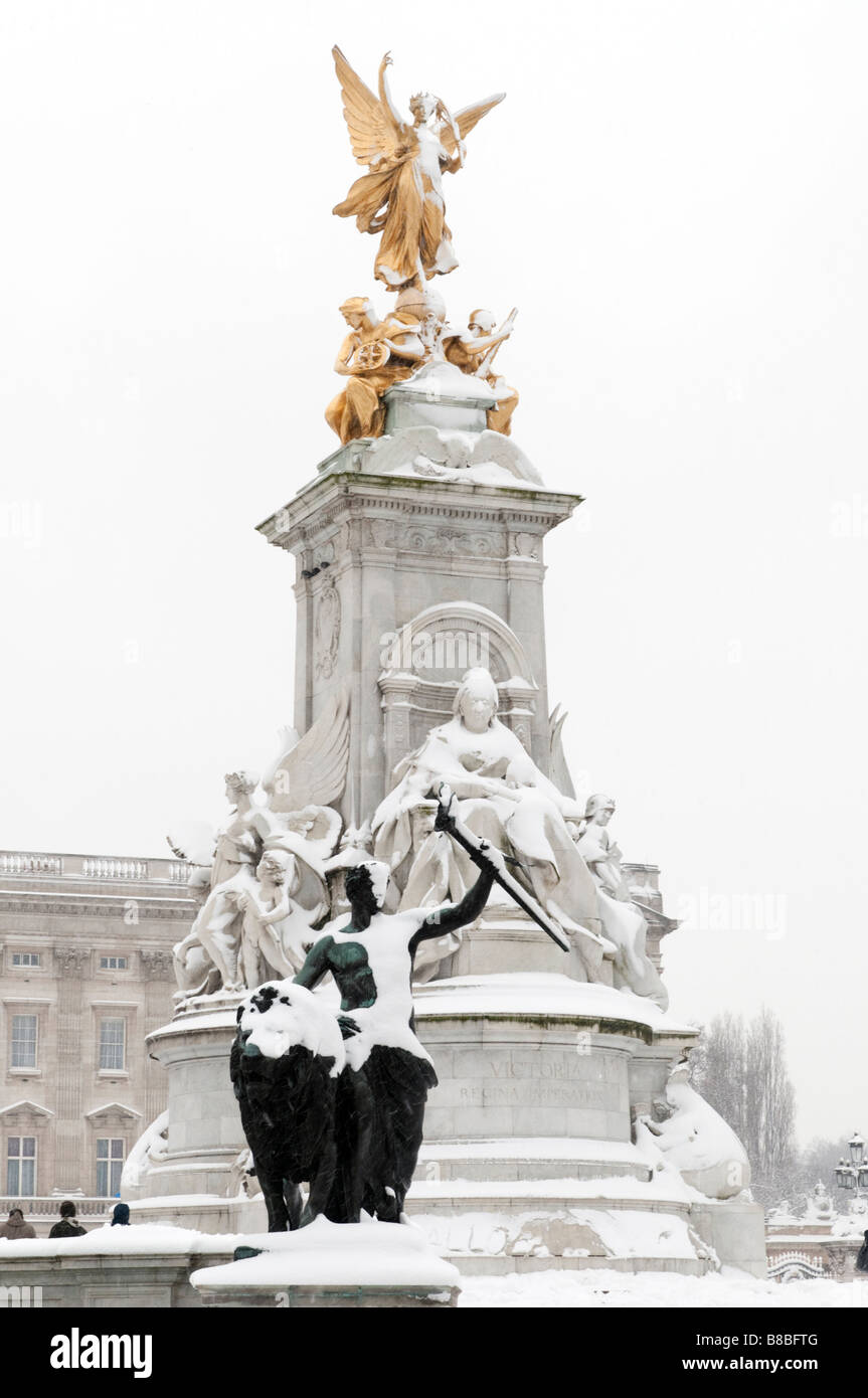 The Victoria Memorial in front of Buckingham Palace in the snow London England UK Stock Photo