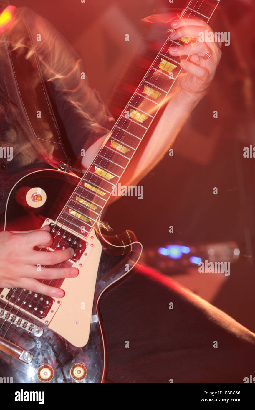 a guitar player at a live concert Stock Photo