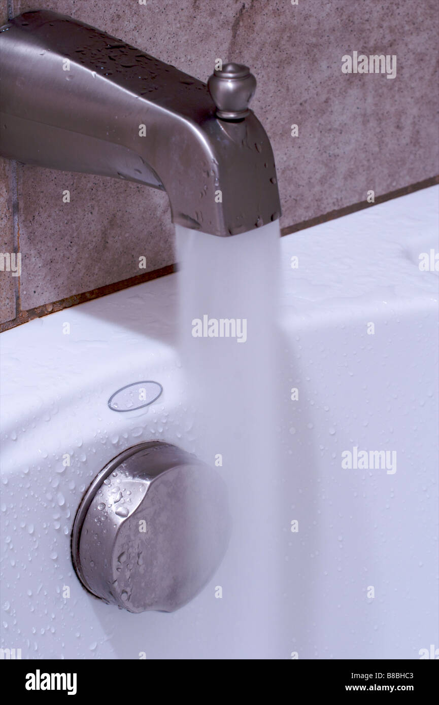 water rushing out of faucet Stock Photo Alamy