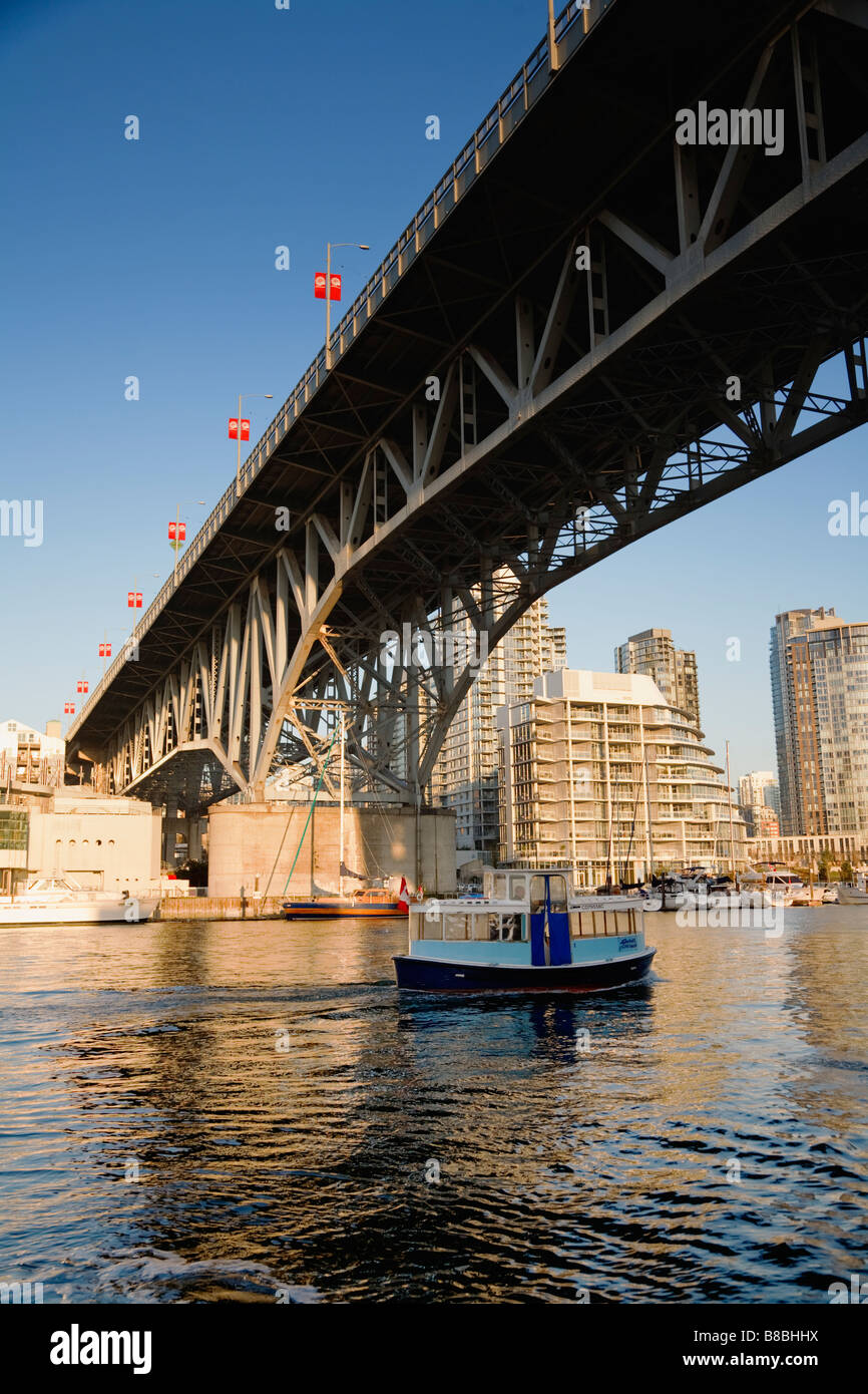A water taxi in False Creek under Granville Bridge Vancouver British