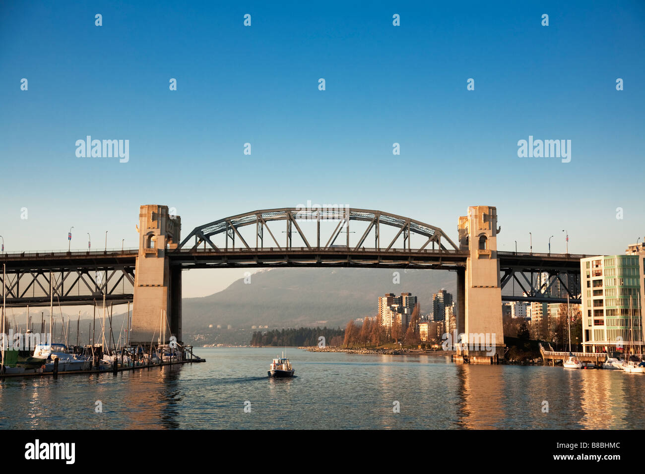 A water taxi in False Creek under the Burrard Street Bridge, Vancouver ...