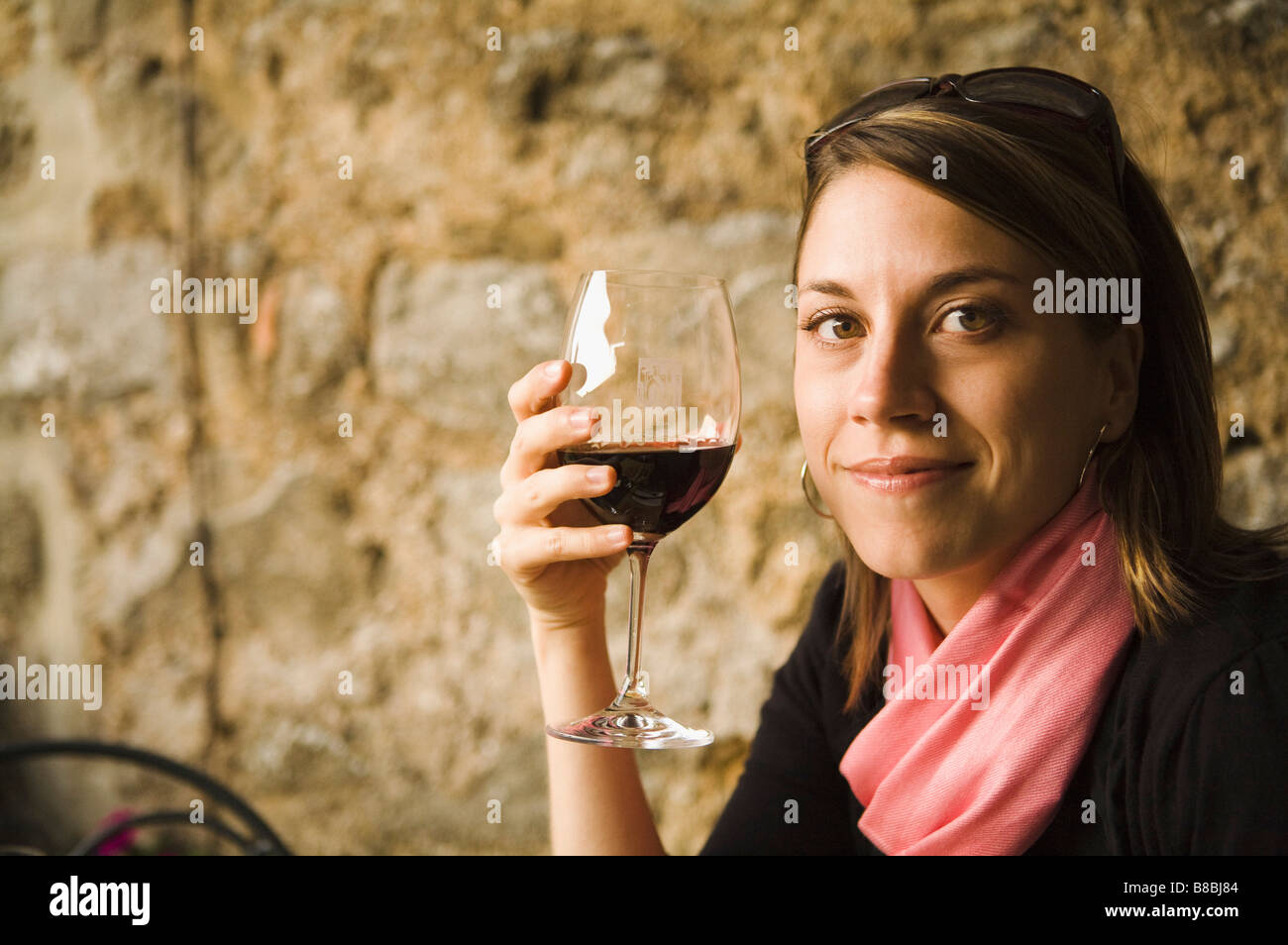 Woman holding glass of wine hi-res stock photography and images - Alamy