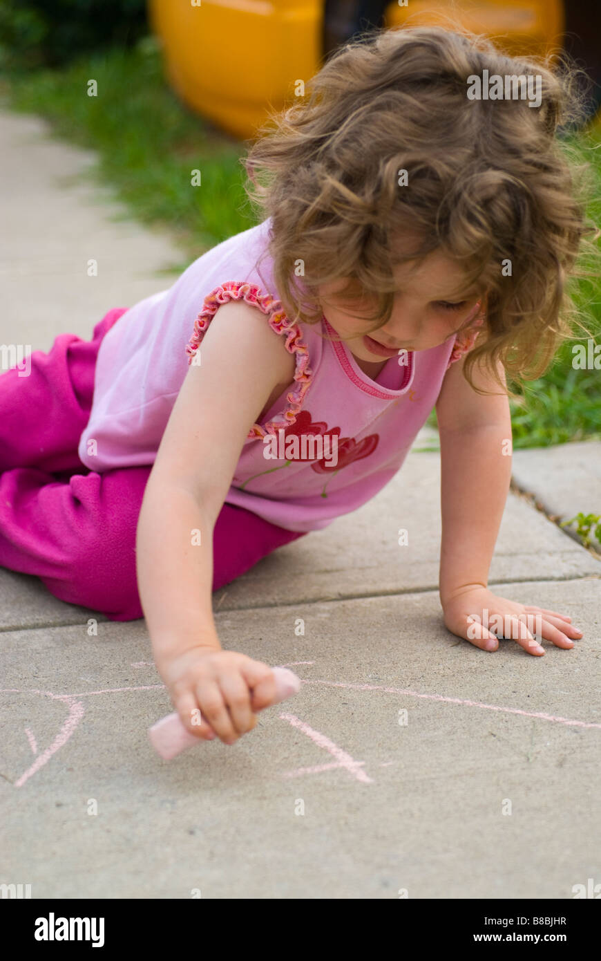 Little Girl Drawing Sidewalk Chalk Summer Stock Photo - Alamy