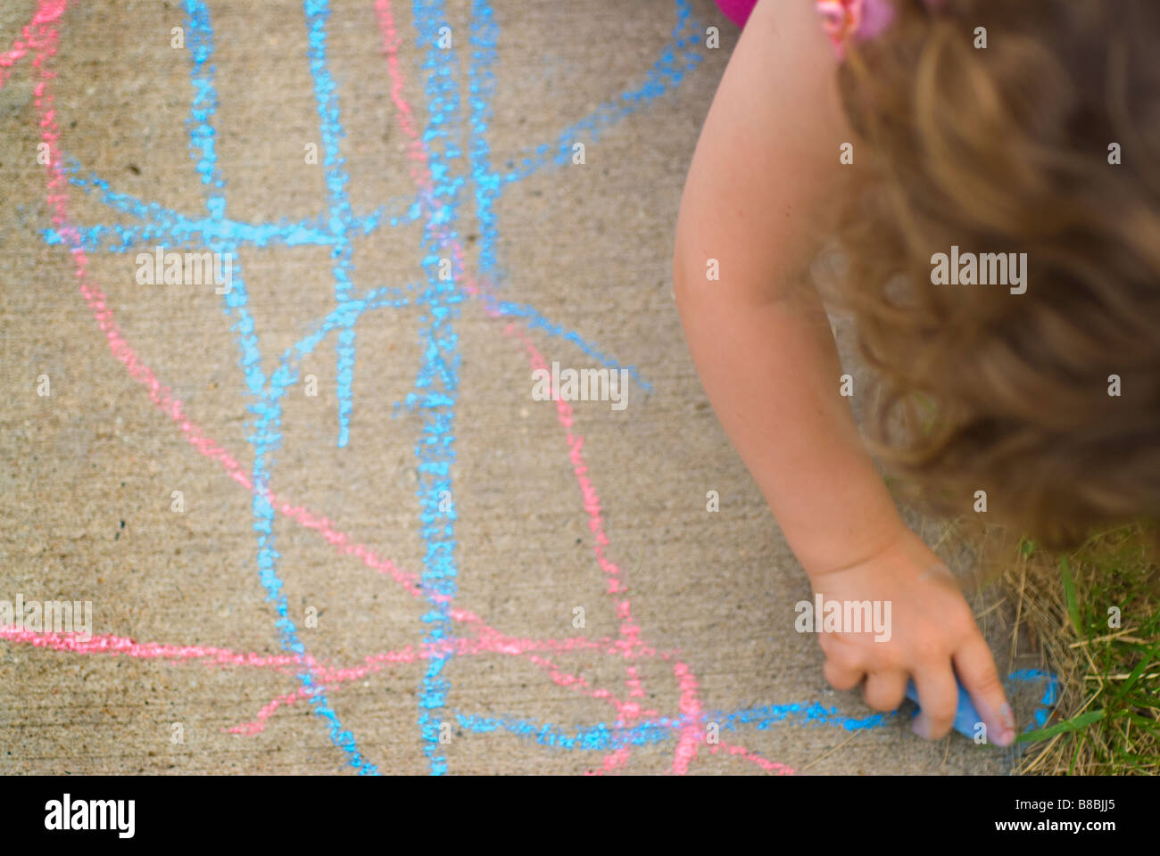 Little Girl Drawing Sidewalk Chalk Summer Stock Photo - Alamy