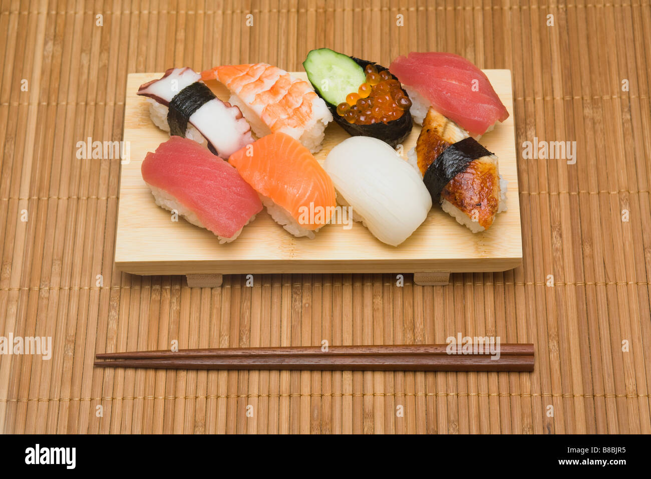 Assortment of nigiri sushi served on a wooden geta Stock Photo