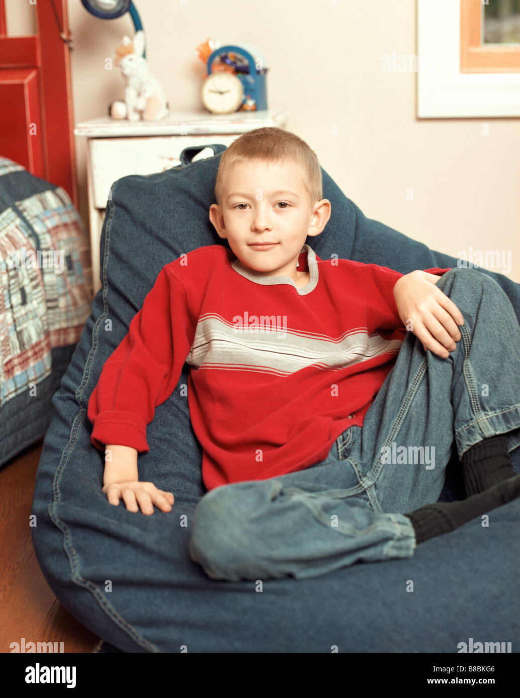 Portrait Boy sitting Bean Bag Chair Stock Photo - Alamy