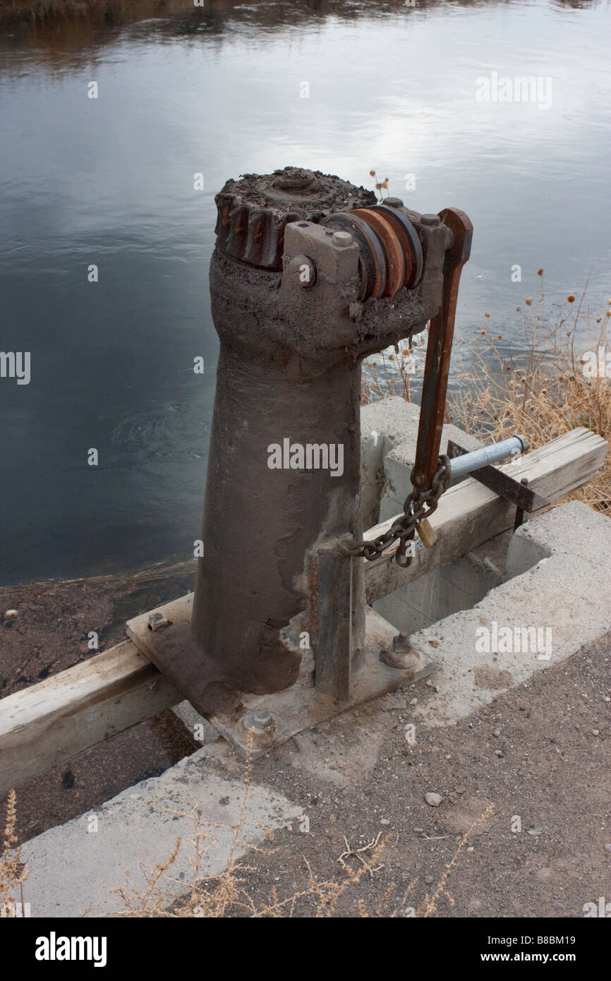 Gear drive mechanism for raising an irrigation gate Stock Photo