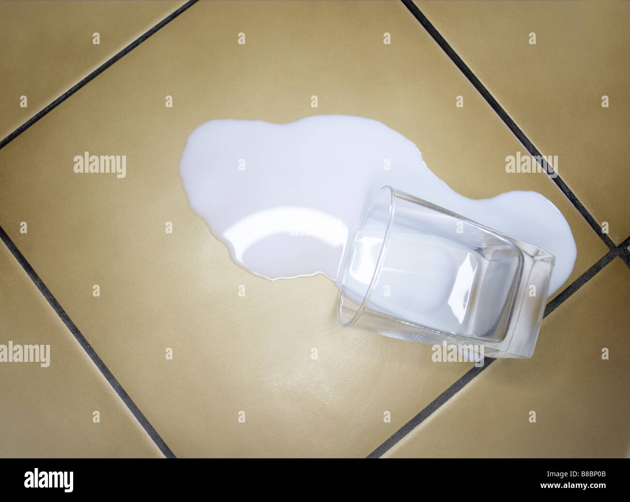 Spilled Glass Milk Tile Floor Stock Photo Alamy