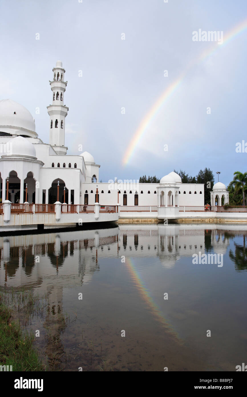 Rainbow and Tengku Tengah Zaharah Mosque, also popularly known as the Floating Mosque in Kuala Terengganu, Malaysia. Stock Photo