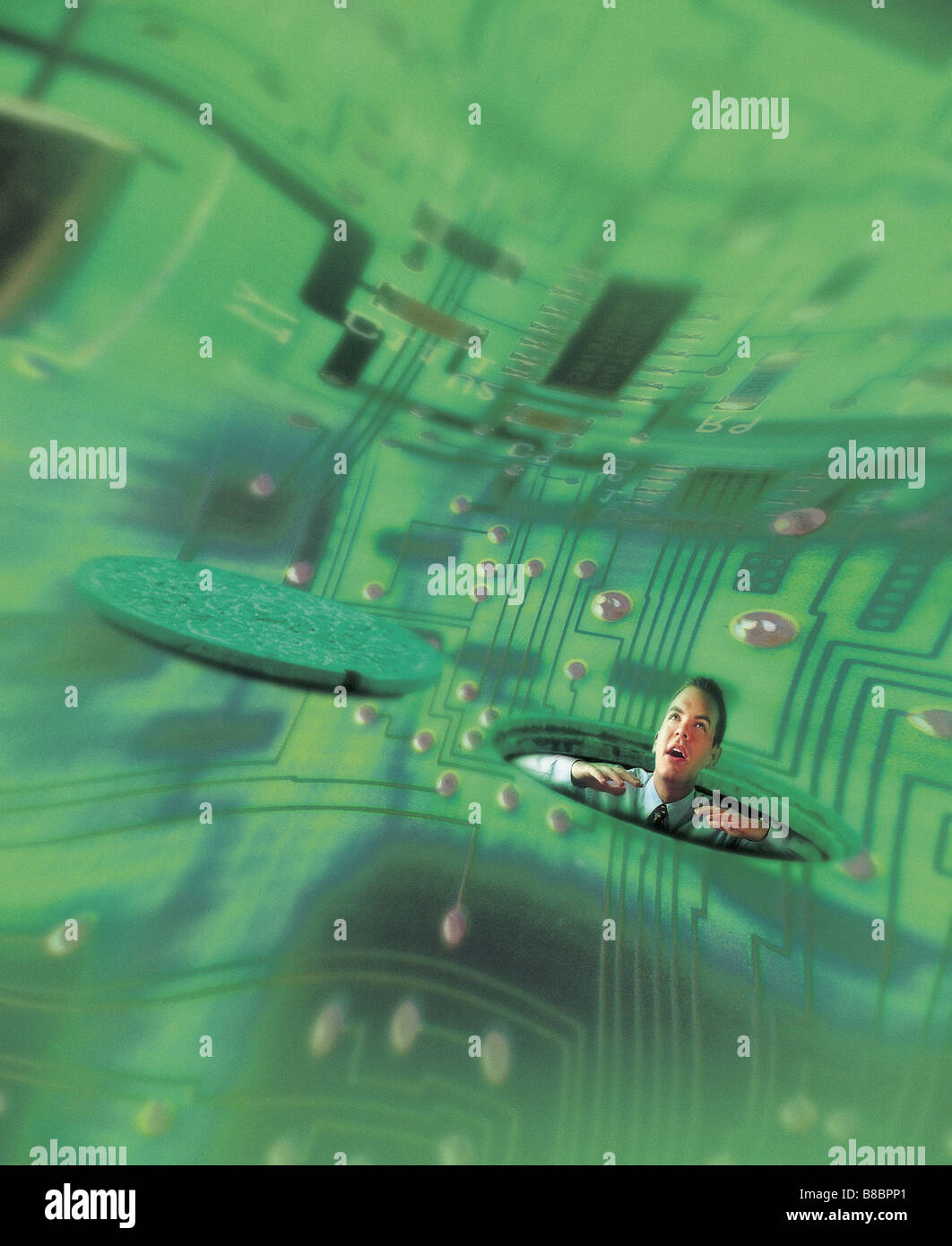 FL4386, Jim Tinios; Man Peering Up Through Manhole into Distorted Green Circuitry Background Stock Photo