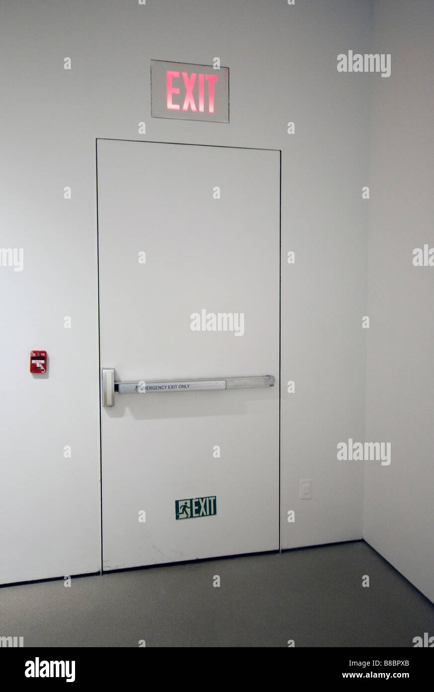 Fire exit and fire alarm built into white wall Stock Photo - Alamy