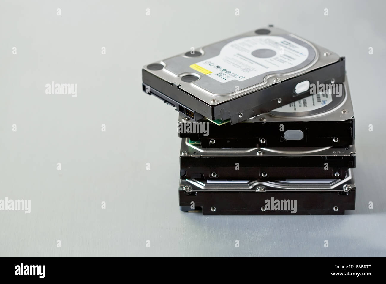 a stack of internal computer hard disk drives used for raid backup Stock Photo