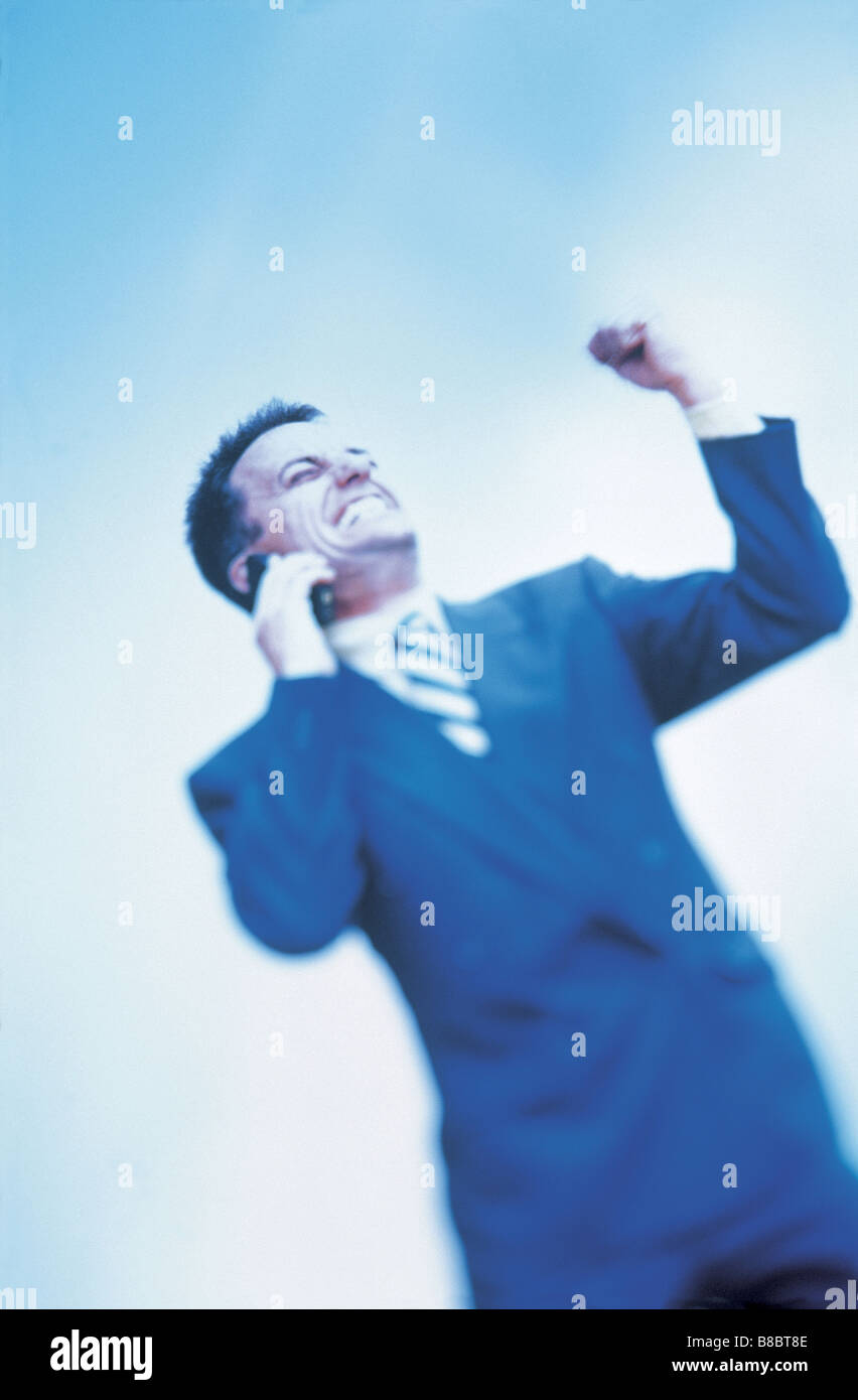 FL4602, G  Huszar; Underview, Businessman Cell Phone, Pumping Fist Air Stock Photo