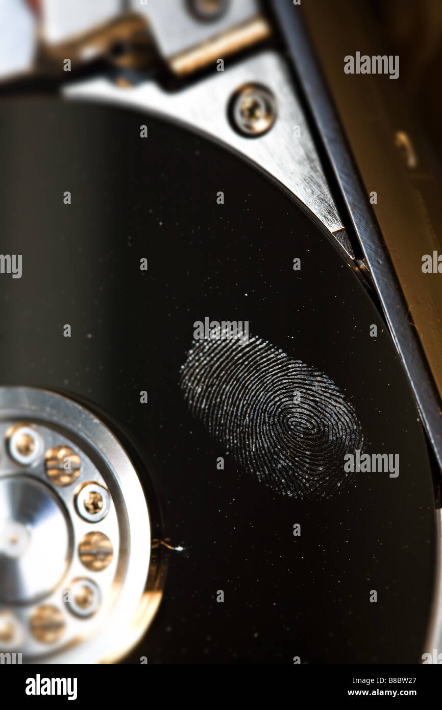 a finger print on the shiny surface a hard disk drive Stock Photo - Alamy