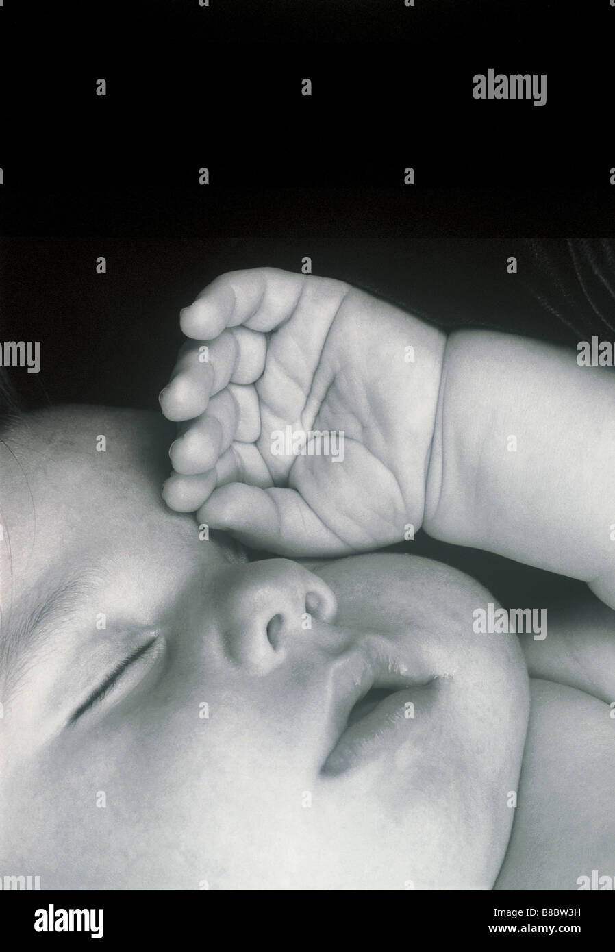 FL4820, Nick Kelsh; Sleeping Baby Rubbing Eyes, BW Stock Photo Alamy