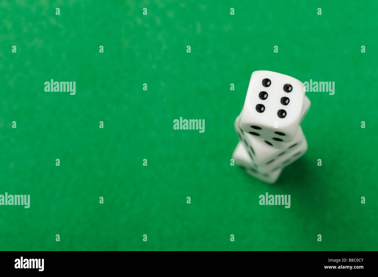 dices Game cubes on a green background Stock Photo Alamy