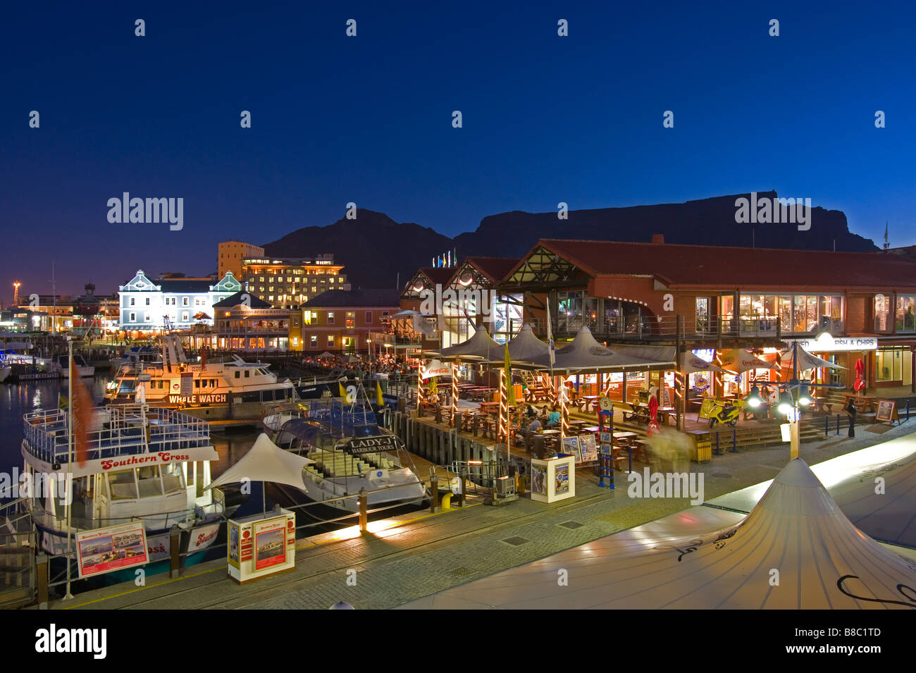 Evening lights at a pier at Victoria & Alfred waterfront Cape Town South Africa Stock Photo
