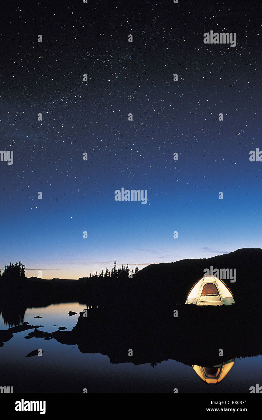 FL5442, David Nunuk; Illuminated Tent  Night Under Starry Sky Stock Photo