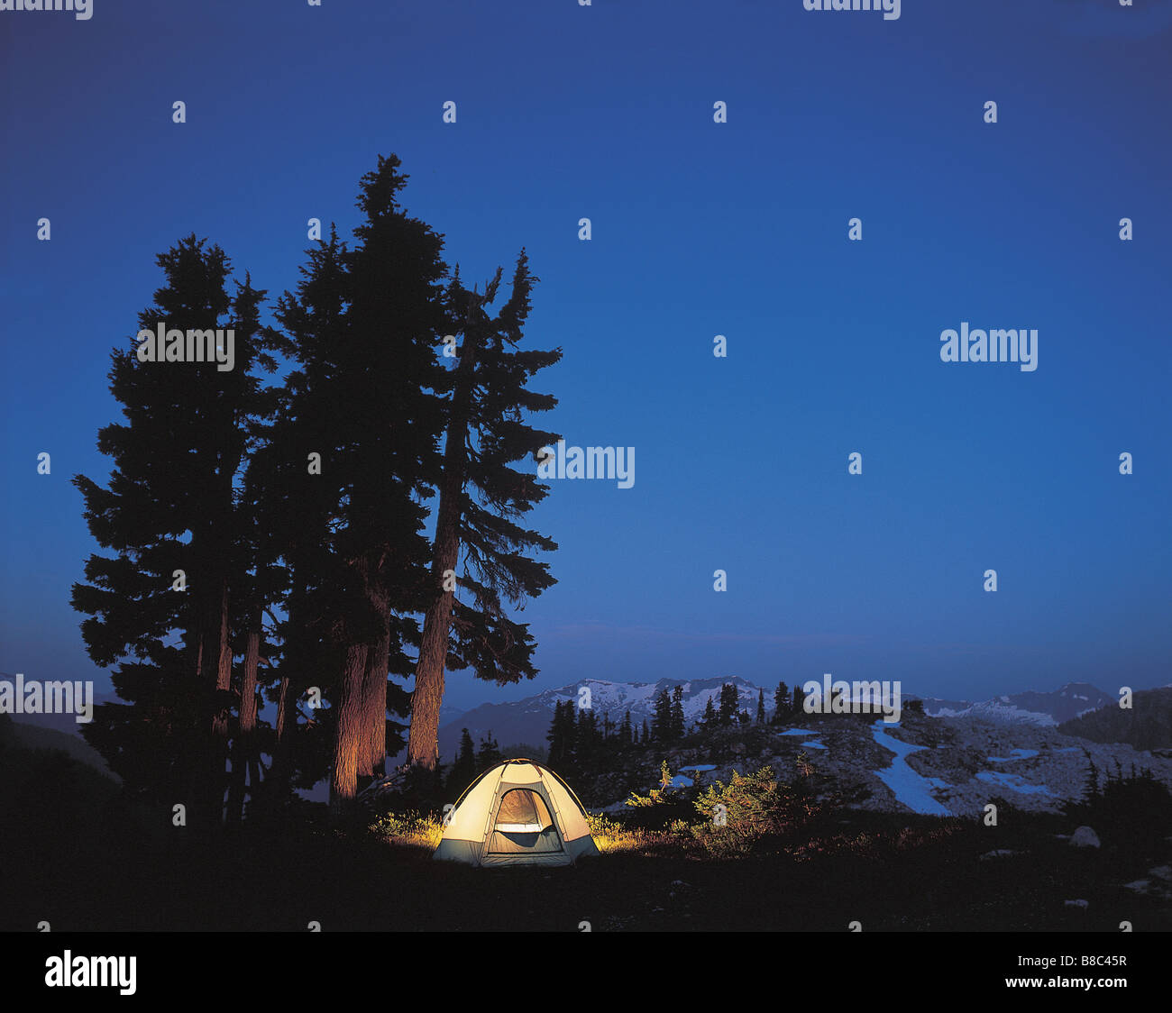 FL5491, David Nunuk; Illuminated Tent Campsite  Night, Tantalus Range, BC Stock Photo