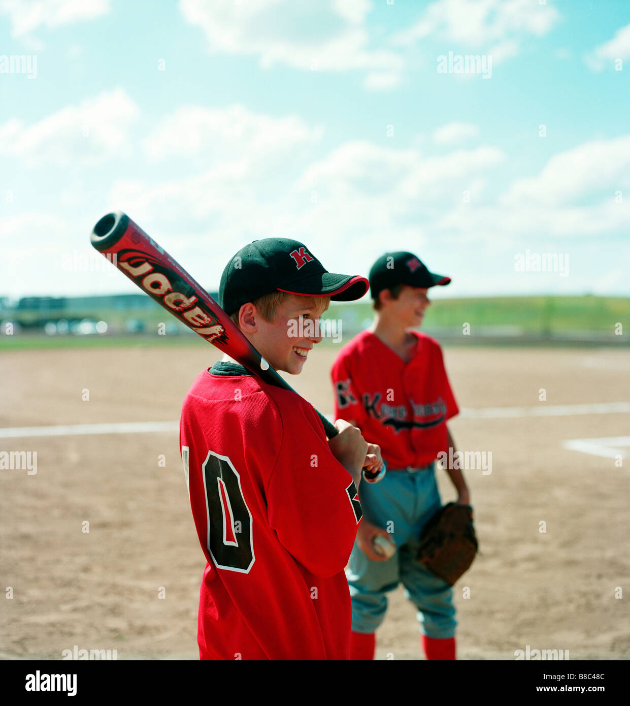 Boy Smiling Baseball Bat over Shoulder, Moncton, New Brunswick Stock
