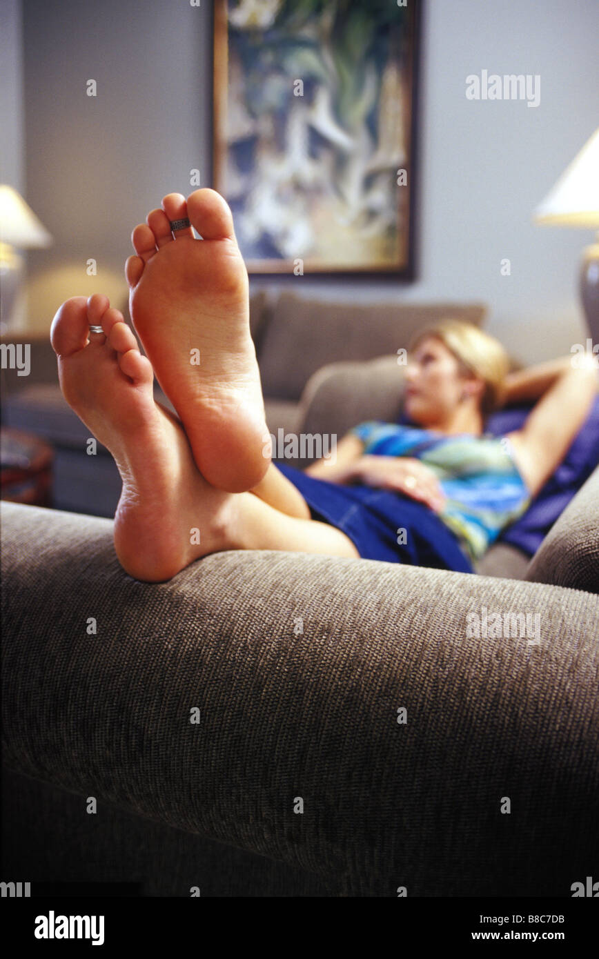 FL6045, Mad Cow Studio; Woman Lying Down Relaxing Sofa, Feet eground