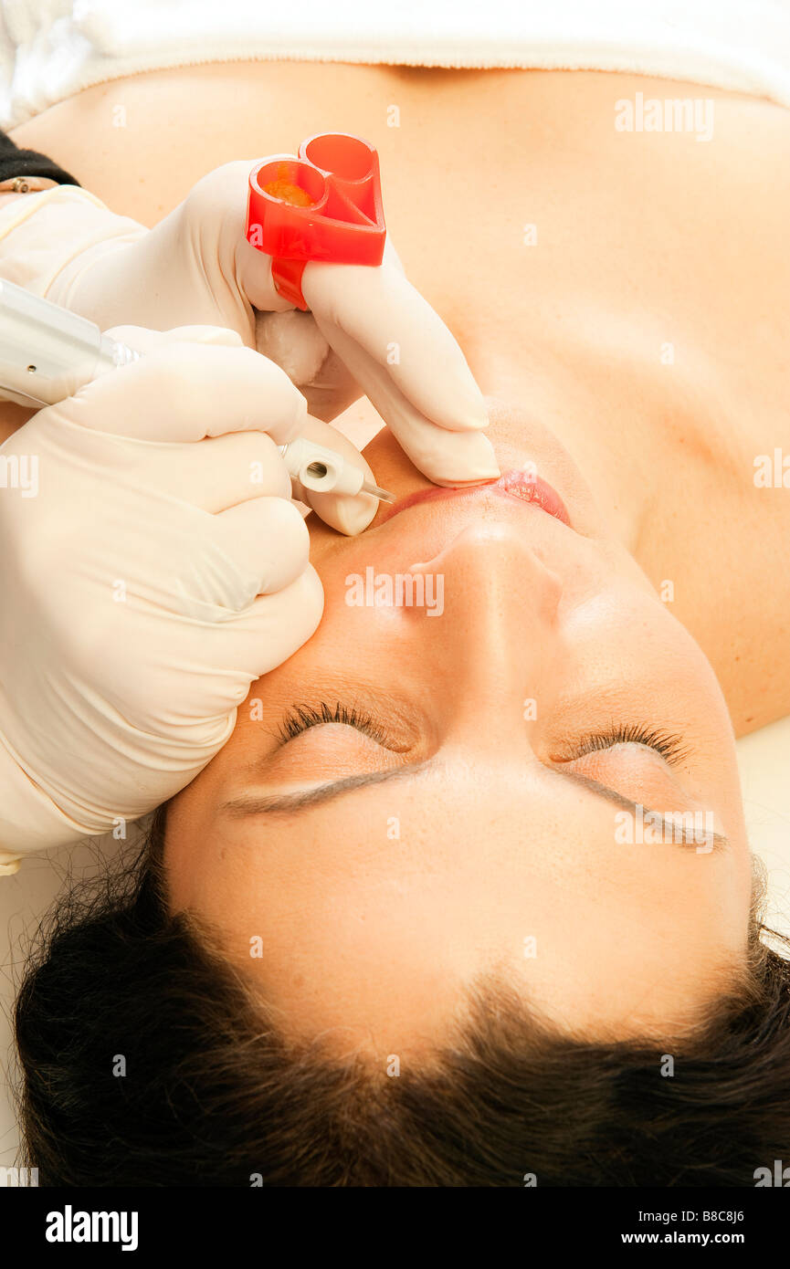 Micro-pigmentation procedure for the lips, permanent make up. Stock Photo