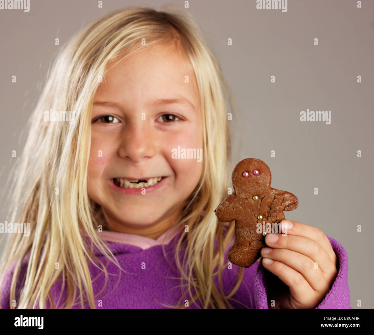Girl holding Gingerbread Man Stock Photo Alamy