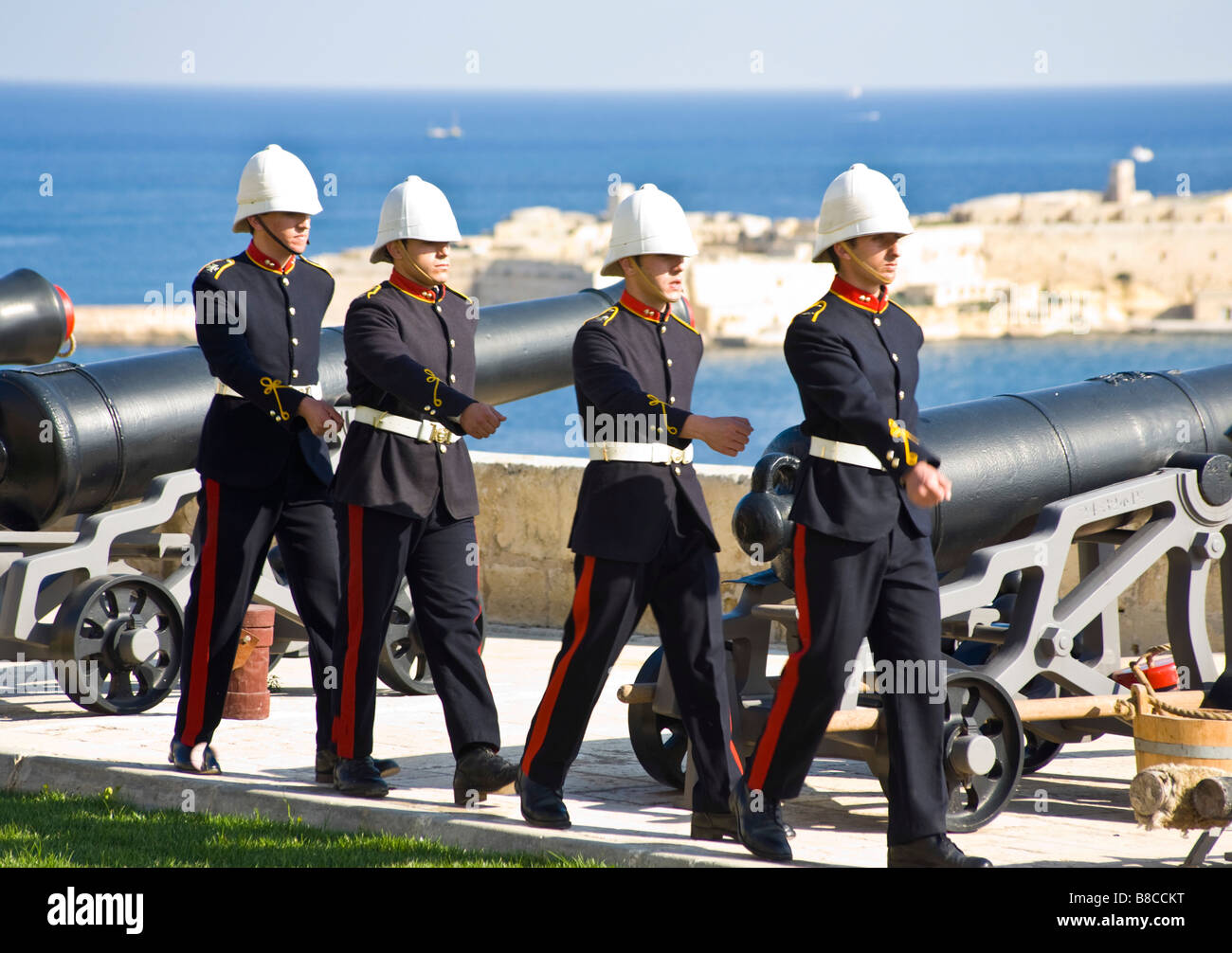 Volunteers in unform after the firing of the noonday gun. Saluting