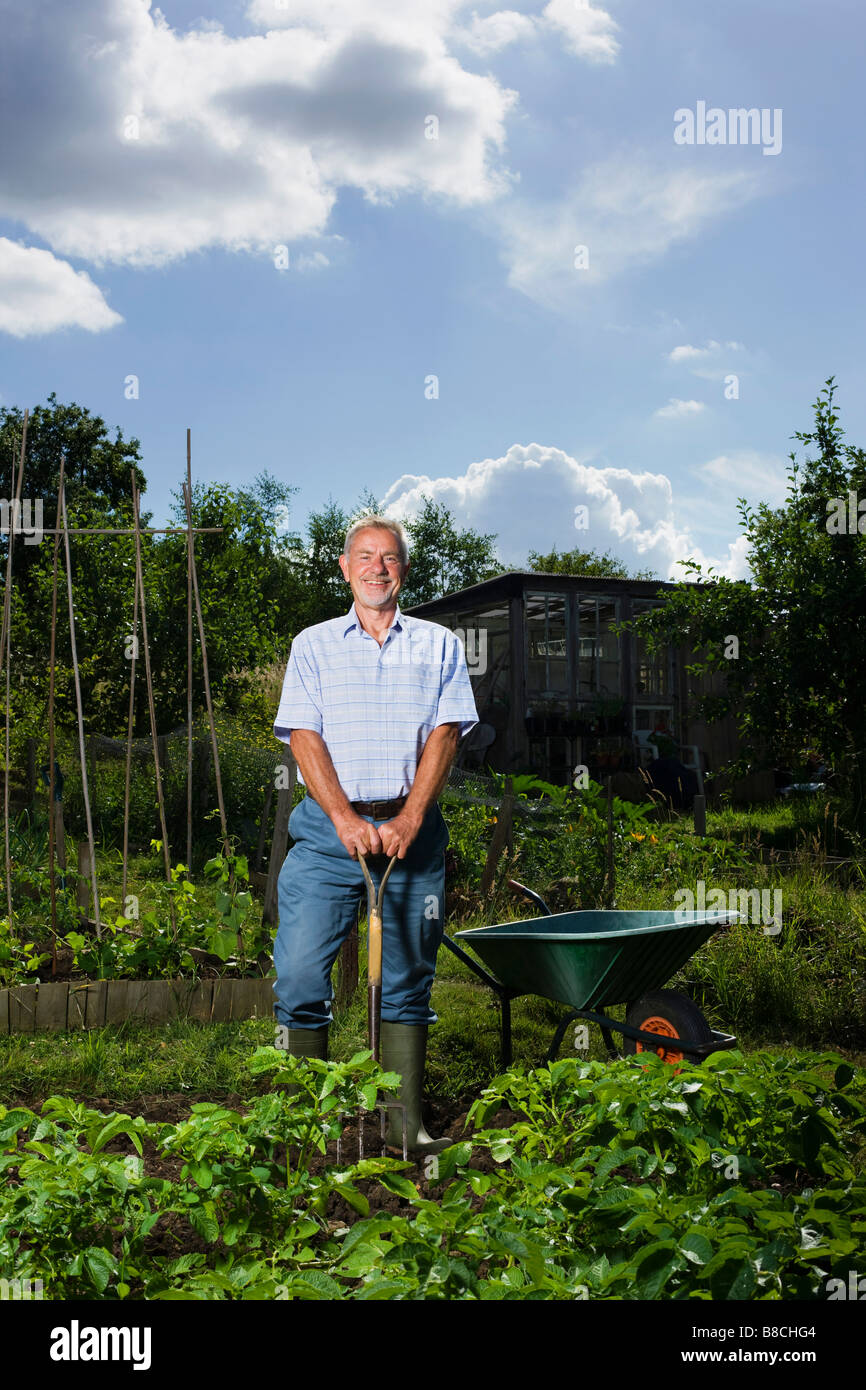 Senior man gardening, portrait Stock Photo - Alamy